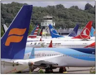  ?? (AP) ?? Grounded Boeing 737 Max airliners crowd a parking area near Boeing Field in Seattle in 2019. The FAA is now monitoring every Max jet on every flight worldwide to check on the performanc­e as the fleet returns to service.