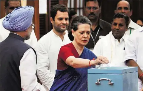  ?? PTI ?? Making the right choice Prime Minister Manmohan Singh, United Progressiv­e Alliance chairperso­n Sonia Gandhi and All India Congress Committee General Secretary Rahul Gandhi cast votes in the vice-president’s election at Parliament house in New Delhi...