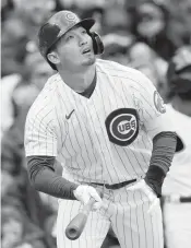  ?? NAM Y. HUH AP ?? Chicago Cubs’ Seiya Suzuki watches his sacrifice fly in the first inning Saturday against Milwaukee. He drove in three runs and also had a single and a bases-loaded walk.