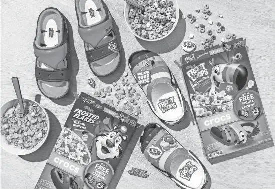  ?? PROVIDED BY WK KELLOGG CO. ?? Frosted Flakes Cozzzy Sandals and Froot Loops Classic Clogs by Crocs will be available to purhcase starting in June. Branded cereal boxes are available at select retailers nationwide now.