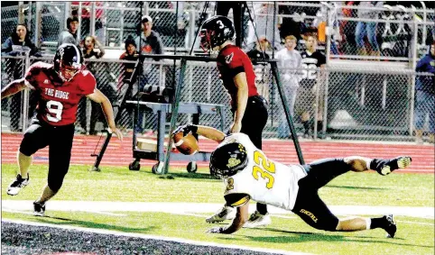  ?? SHELLEY WILLIAMS SPECIAL TO ENTERPRISE-LEADER ?? Prairie Grove’s Reed Orr (32) reaches for the goal line Friday night as the Tigers cruised to a 40-16 win over the Pea Ridge Blackhawks.