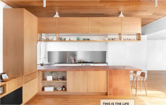  ??  ?? KITCHEN Above and opposite American oak, used here for both joinery and flooring, is a unifying thread throughout the home. Muuto ‘Nerd’ stools, Living Edge. Island bench clad in Cotto Manetti ‘Naturale’ terracotta tiles from Artedomus. Etnico runner, Pampa. Cushions from Tigmi Trading (on sofa).