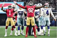  ?? Smiley N. Pool/The Dallas Morning News via AP ?? San Francisco 49ers defensive end Charles Omenihu (92) celebrates after sacking Dallas Cowboys quarterbac­k Dak Prescott (4) during an NFL wild-card playoff game Sunday in Arlington, Texas.