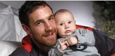  ??  ?? FAMILY MAN: Giants ruckman Shane Mumford at home with his baby son Ollie. PHOTO: PHIL HILLYARD