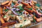  ?? A LITTLE YUMMINESS ?? Roasted carrots and tofu, tossed in a sprightly sesame-oil vinaigrett­e, make a wonderful addition to a grain bowl.