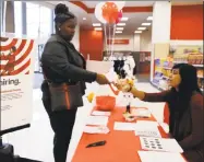  ?? Nam Y. Huh / Associated Press ?? A Target human resources representa­tive talks with a job seeker at a Target store in Chicago.