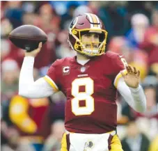  ?? | MARK TENALLY/ AP ?? Quarterbac­k Kirk Cousins reportedly plans to sign a fully guaranteed three- year, $ 84 million contract with the Vikings.