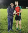  ??  ?? Brendan Lawrence presents Conor Reid with the Wicklow People Man of the Match award.