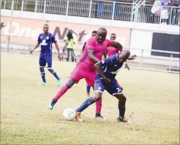  ??  ?? POWER PLAY . . . Herentals’ Innocent Benza (in red strip) tussles for possession with Dynamos midfielder James Marufu at Rufaro yesterday