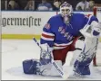  ?? SETH WENIG - THE ASSOCIATED PRESS ?? FILE - New York Rangers’ Henrik Lundqvist reacts after a save during the third period of an NHL hockey game against the Philadelph­ia Flyers in New York, in this Sunday, March 1, 2020, file photo. The Flyers defeated the Rangers 5- 3.