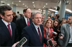  ?? The Associated Press ?? BORDER BARGAINERS: Sen. John Hoeven, R-N.D., center, speaks as he is joined by Rep. Tom Graves, R-Ga., far left, Sen. Richard Shelby, R-Ala., the top Republican on the bipartisan group of bargainers working to craft a border security compromise in hope of avoiding another government shutdown, and Sen. Shelley Moore Capito, R-W.Va., right, after a briefing with officials about the US-Mexico border Wednesday on Capitol Hill in Washington.