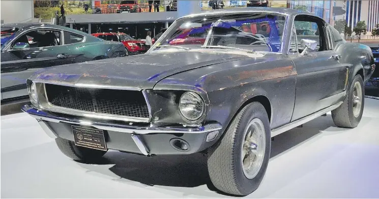  ?? PHOTOS: DEREK MCNAUGHTON/DRIVING ?? The original 1968 Ford Mustang is displayed at the North American Internatio­nal Auto Show in Detroit with the 2018 Ford Mustang Bullitt.