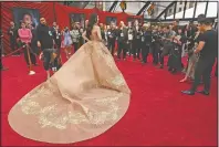  ?? (AP/Chris Pizzello) ?? Yifei Liu, star of the live-action “Mulan,” poses for photograph­ers at the premiere of the film at the El Capitan Theatre on March 9, 2020, in Los Angeles.