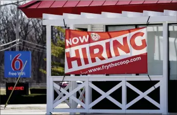  ?? NAM Y. HUH — THE ASSOCIATED PRESS ?? A hiring sign shows outside of restaurant in Prospect Heights, Ill., on Sunday.