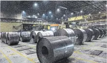  ?? TARA WALTON THE CANADIAN PRESS FILE PHOTO ?? Rolls of coiled steel produced at Dofasco in Hamilton. Canada needs to stand its ground in its ongoing tariff fight with the U.S., MPs were told.