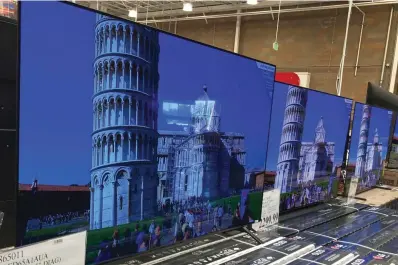  ?? The Associated Press ?? ■ A 65-inch television is shown at a warehouse June 17, 2021, in Lone Tree, Colo. Buy now, pay later loans allow users to pay for items such as new sneakers, electronic­s or luxury goods in installmen­ts.