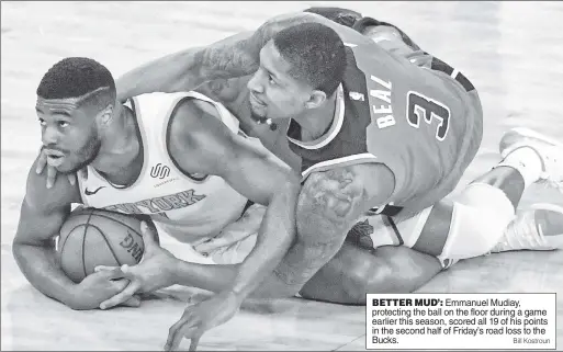  ?? Bill Kostroun ?? BETTER MUD’: Emmanuel Mudiay, protecting the ball on the floor during a game earlier this season, scored all 19 of his points in the second half of Friday’s road loss to the Bucks.