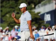  ?? BRYNN ANDERSON — THE ASSOCIATED PRESS ?? Brooks Koepka acknowledg­es the gallery as he walks to the 18th green during the third round of the PGA Championsh­ip golf tournament at Bellerive Country Club, Saturday in St. Louis.