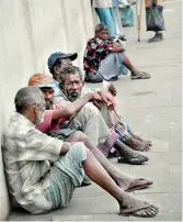  ??  ?? Beggars line the road side: The eternal conflict between the haves and the have nots.