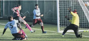  ??  ?? Pennywell Comrades hit their second goal against Hendon Athletic on the 3G pitch at Silksworth Complex.