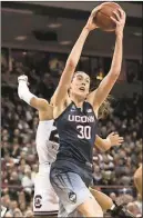  ??  ?? Sean Rayford / AP
UConn’s Breanna Stewart (30) grabs a rebound in front of South Carolina’s A’ja Wilson during the first half of Monday’s game in Columbia, S.C.