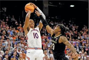  ?? Associated Press ?? Top pick for Magic?: Auburn forward Jabari Smith (10) shoots a 3-pointer over Vanderbilt guard Jamaine Mann (23) during the second half of an NCAA college basketball game Feb. 16, 2022, in Auburn, Ala. Smith is one of the top forwards in the upcoming NBA draft.