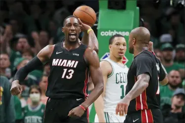  ?? MICHAEL DWYER — THE ASSOCIATED PRESS ?? Miami Heat’s Bam Adebayo (13) celebrates after scoring against the Boston Celtics during the second half of Game 3of the NBA basketball playoffs Eastern Conference finals Saturday, May 21, 2022, in Boston.