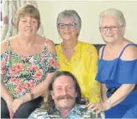  ??  ?? Linda Dobson, from Huncoat (pictured in yellow top), will take part in a charity head shave to mark her 70th birthday