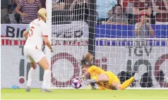  ?? LAURENT CIPRIANI/ASSOCIATED PRESS ?? A diving U.S. goalkeeper Alyssa Naeher saves a penalty kick from England’s Steph Houghton. It was the first penalty kick saved by an American keeper in regular time in the U.S.’s World Cup history.