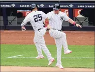  ?? Steven Ryan / Getty Images ?? Yankees’ third base coach Phil Nevin, right, tested positive for COVID-19 on Tuesday and went into quarantine.