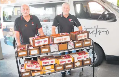  ?? Photo / Bevan Conley ?? Mac McCallion (left) and Kyle Dalton with some of the RSA’s poppy boxes that are bound for local businesses.