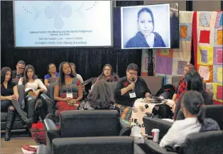  ?? CP PHOTO ?? The family of Nicole Daniels speaks to commission­er Michelle Audette at the opening day of hearings at the National Inquiry into Missing and Murdered Indigenous Women and Girls in Winnipeg, Oct. 16.