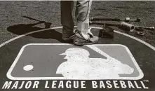  ?? Charles Rex Arbogast / Associated Press ?? MLB players insist they receive their full prorated salaries based on the number of regular-season games.