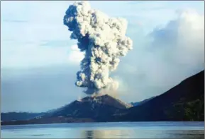  ?? NESS KERTON/AFP ?? Mount Tavurvur erupts in Rabaul in eastern Papua New Guinea on August 30, 2014. Thousands of residents are being evacuated as volcanic activity escalates, sparking fears of a tsunami.