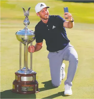  ?? TOM PENNINGTON/GETTY IMAGES ?? Daniel Berger takes a selfie after winning the Charles Schwab Challenge.