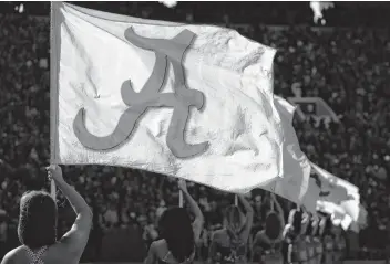  ?? Butch Dill / Associated Press ?? Alabama is flying high as it maintains the No. 1 spot in the rankings after beating Mississipp­i State 24-0 for the Crimson Tide’s second consecutiv­e shutout.