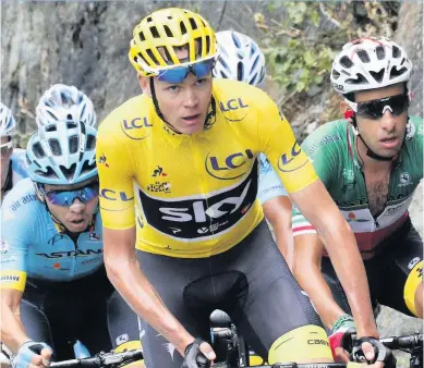  ??  ?? Chris Froome in the yellow race leader’s jersey during one of his four victories in the Tour de France
