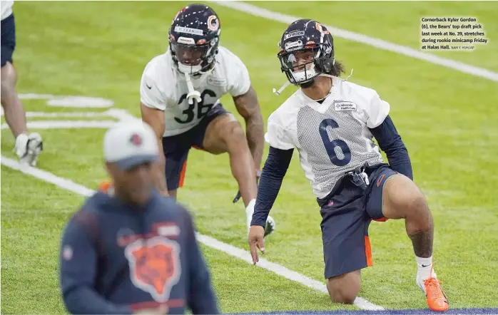  ?? NAM Y. HUH/AP ?? Cornerback Kyler Gordon (6), the Bears’ top draft pick last week at No. 39, stretches
during rookie minicamp Friday at Halas Hall.