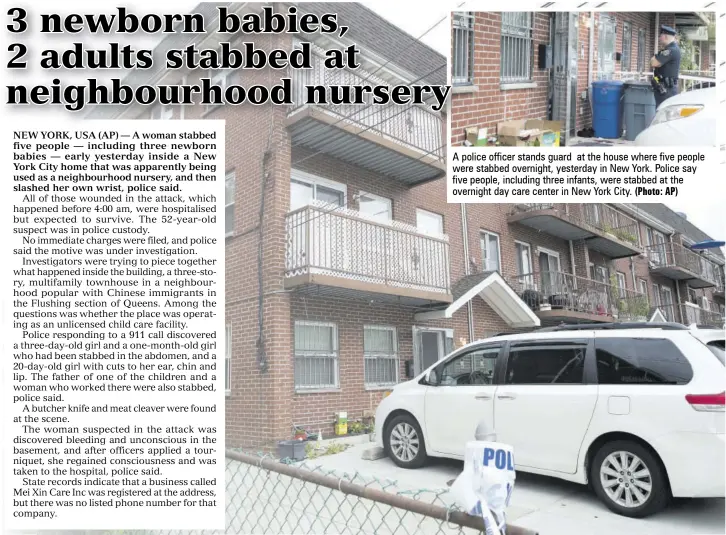  ?? (Photo: AP) ?? A police officer stands guard at the house where five people were stabbed overnight, yesterday in New York. Police say five people, including three infants, were stabbed at the overnight day care center in New York City.