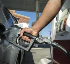  ?? MARCUS OLENIUK/TORONTO STAR FILE PHOTO ?? The upward forces driving inflation were led by year-over-year price increases last month of 8.6 per cent at the gas pump, 6.3 per cent for traveller accommodat­ion and 6.2 per cent for air transporta­tion.