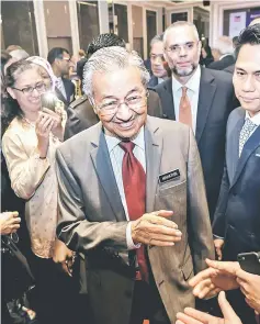  ?? — Bernama photo ?? Dr Mahathir shares a light moment with guests during the American Malaysian Chamber of Commerce luncheon yesterday.