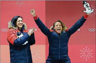  ?? [PHOTOS BY MICHAEL SOHN/THE ASSOCIATED PRESS] ?? Driver Elana Meyers Taylor (left) and Lauren Gibbs of the United States celebrate winning the silver medal during the women’s two-man bobsled final at the Winter Olympics Wednesday in Pyeongchan­g, South Korea.