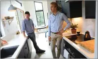  ?? ARIC CRABB — STAFF PHOTOGRAPH­ER ?? John Geary, left, and Eric McInerney, co-founders of Abodu, stand inside one of their prefab modular homes in Redwood City.