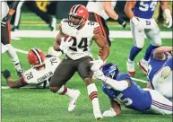  ?? Seth Wenig / Associated Press ?? Cleveland Browns’ Nick Chubb (24) rushes during the second half of an NFL game against the New York Giants on Sunday in East Rutherford, N.J. The Browns beat the Giants 20-6, New York’s second loss in a row which dimmed the team’s playoff hopes.