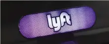  ?? DENVER POST FILE ?? LYFT TURN: A Lyft sign is seen in a ride-hailing driver’s vehicle. Police now say a reported abduction from the Faneuil Hall area over the weekend was the result of an Allston woman getting into the wrong vehicle, which took her north instead of home.