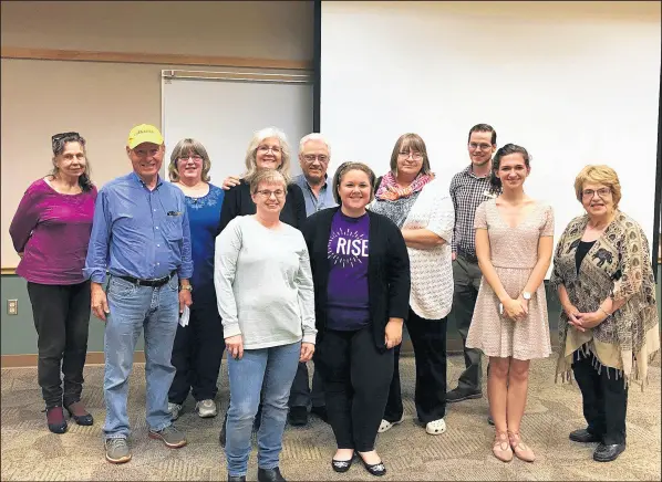  ?? SARAH FERRARO/POST-TRIBUNE ?? Rise NWI co-founder Sarah Ferraro, in a Rise shirt at center, presented a workshop in October at the Cedar Lake library giving an overview of the 2018 election landscape. She has worked on campaigns in Wisconsin and Indiana, including Valparaiso attorney Jim Harper’s bid for secretary of state.