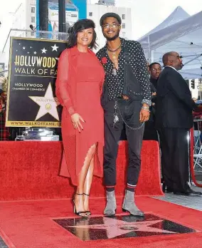  ?? Getty Images file photo ?? “A lot of Black youth are struggling with complex trauma,” says Henson, with son Marcell. She advocates therapy to help them avoid destructiv­e coping mechanisms.