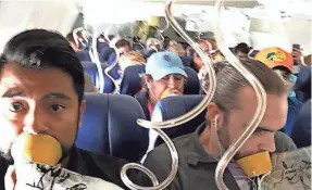  ?? MARTY MARTINEZ VIA AP ?? Marty Martinez, left, captured the terrifying moments in the cabin after the Boeing 737’s engine blew and smashed out a window.