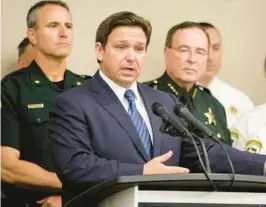  ?? FILE ?? Gov. Ron DeSantis announces the suspension of Hillsborou­gh County State Attorney Andrew Warren during a news conference Aug. 4 at the Hillsborou­gh County Sheriff’s Office administra­tion building in Tampa.