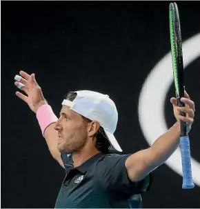  ?? GETTY IMAGES ?? Frenchman Lucas Pouille celebrates his victory over the higher-ranked Milos Raonic in an Australian Open quarterfin­al in Melbourne.